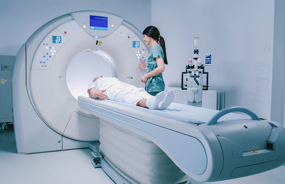 Patient lying on diagnostic equipment MRI Machine